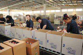 Packing of Salei Mazon at the Slager Logistic Center, home of the Blavatnik Food Bank, Beer Tuvia